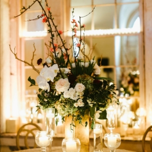 kim starr wise floral décor for new orleans wedding reception centerpieces include antique green hydrangea, gold manzanita, tulips, roses, dahlias, halaenopsis orchids, dark green foliage
