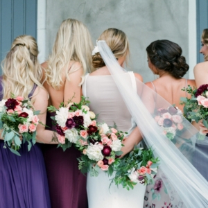colorful bride and bridesmaid bouquets for fall wedding in new orleans created by kim starr wise floral events bouquets with roses, dahlias, ranunculus, foliage, greenery