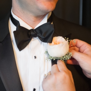 the groom's boutonniere was peach garden rose created by kim starr wise floral events