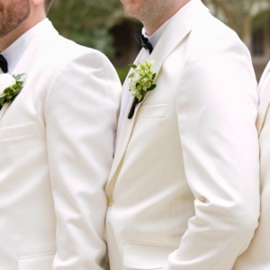 kim starr wise floral events in new orleans spring wedding groomsmen white boutonnieres with green accents and white dinner jackets