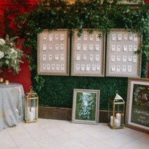 wedding reception table assignments floral decor with white flowers and greenery by event florist kim starr wise
