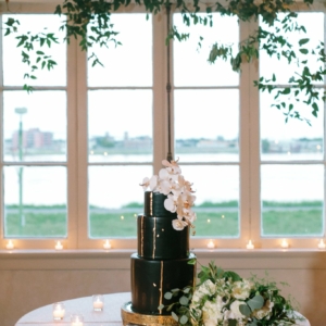 vines and greenery decorate windows at the wedding reception overlooking the mississippi river in french quarter by kim starr wise