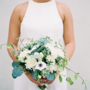 white flowers and greenery bridesmaid bouquet for fall wedding in new orleans featured in martha weddings with floral design by kim starr wise event florist