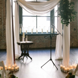 wedding chuppah decorated with greenery and florals for new orleans fall wedding by kim starr wise floral events