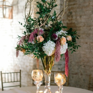wedding reception centerpieces for a fall wedding in new orleans in shades of white, burgundy, blush, peach, and plum florals with greenery by kim starr wise floral events