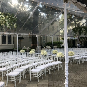 st charles avenue wedding ceremony new orleans louisiana elms mansion blush ivory and white flowers southern wedding, winter wedding, outdoor wedding rain plan clear top tent floral decor by kim starr wise wedding florist tent chandeliers and aisle flowers