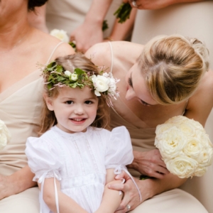 flower girl wears delicate head wreath and mono-botanical bridesmaid bouquet blush ivory and white flowers color palate in st charles avenue wedding new orleans louisiana elms mansion blush ivory and white flowers southern winter wedding floral decor by kim starr wise wedding and event florist