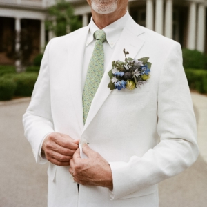 floral pocket square in a white linen suit created by event florist kim starr wise wedding florals new orleans louisiana
