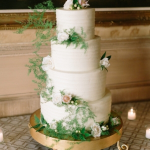 greens and white florals decorate the wedding cake new orleans wedding by kim starr wise