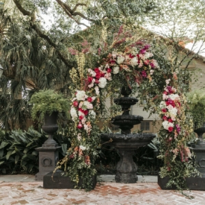 new orleans spring wedding floral arrangements kim starr wise rustic wedding arch with dense greenery