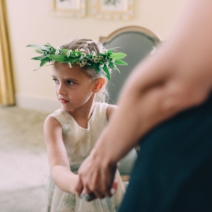 flower girl wears small head wreath and carried a pomander on the new orleans wedding day hair flowers created by kim starr wise floral events
