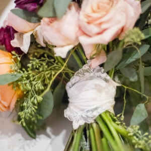 bridal bouquet for fall wedding in new orleans wrapped in hankerchief that kim starr wise used to hold vibrant floral bridal bouquet together