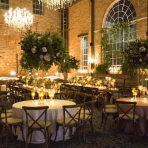 tasteful wedding flowers with heavy greenery and less floral-based reception decor for southern wedding in louisiana by kim starr wise floral artist and event florist