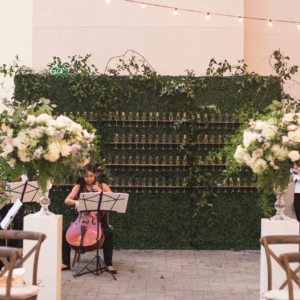 kim starr wise floral design team created champagne wall decor of smilax for the champagne hedge walls at southern wedding in new orleans