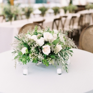centerpieces were lush and beautiful arrangements in all white and ivory with draping foliage accents