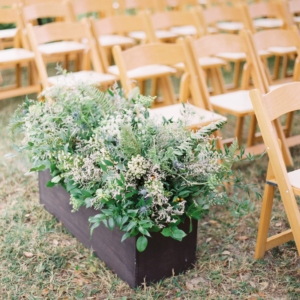 ferns, ruscus, limonium, queen anne’s lace, blue thistle and wax flower aisle decor at mississippi gulf coast wedding in october wedding ceremony with textured greenery foliage and wildflowers