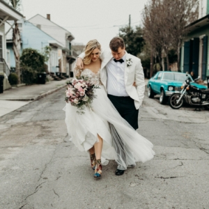 wild and asymmetrical florals in shades of pale pink mauve and green for french quarter wedding on new years eve by florist kim starr wise