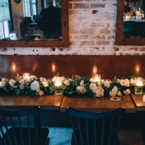 new-orleans-wedding-florals-kim-starr-wise-banquet-table-center-garland-with-floral-flowers-accent-white-ivory-spray-rose-floating-candles-greenery-foliage-runner-wreath