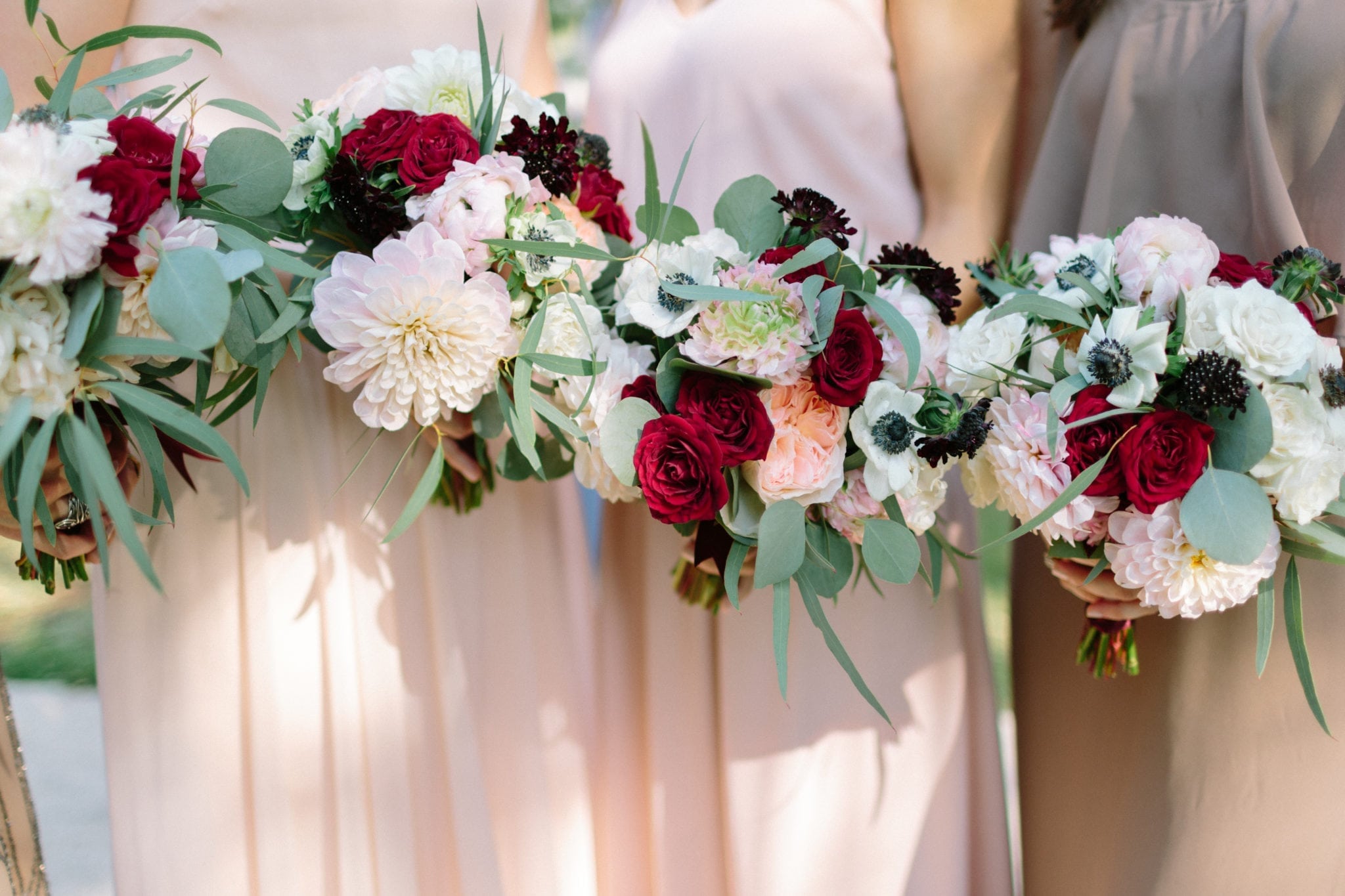 blush, pale pink, dark burgundy tones and greenery bridesmaid bouquets for new orleans fall wedding by kim starr wise floral events