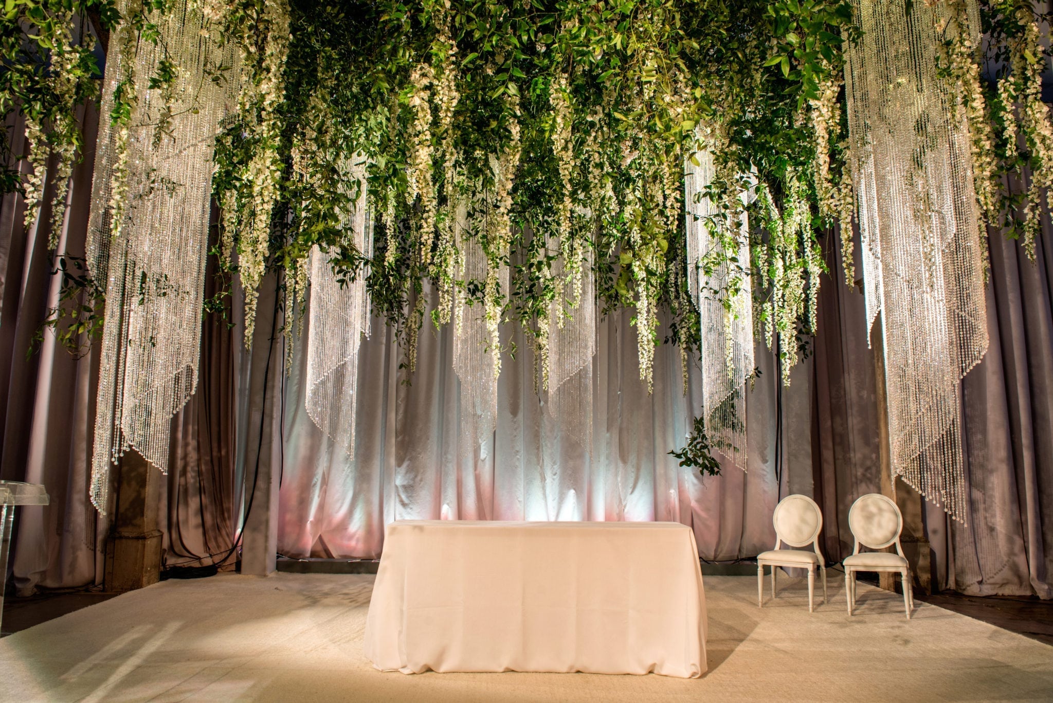 elegant wedding florals for january wedding in new orleans louisiana event florals by kim starr wise created dreamy secret garden with vines and flowers for wedding ceremony altar with chandeliers